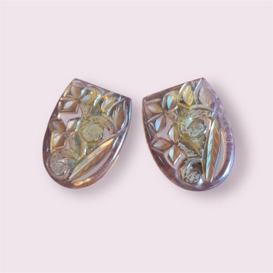 Matched pair carved clear amber coloured dress clips

