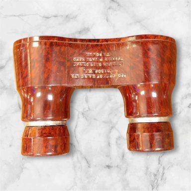 Brick red bakelite opera glasses UADC Ltd London
